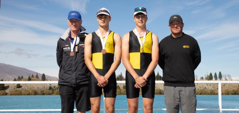 Standing on the podium following their bronze medal in the boys under-18 novice double sculls are...