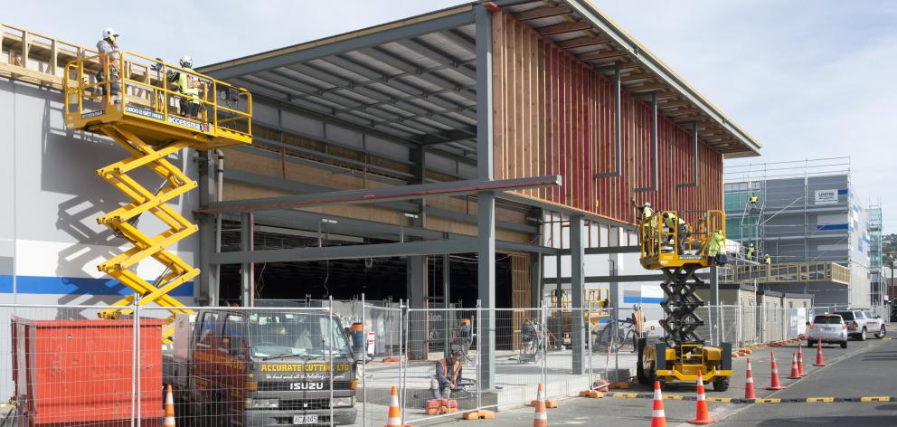 Contractors work on the main entrance to Dunedin’s new Kmart store yesterday. PHOTO: GERARD O’BRIEN