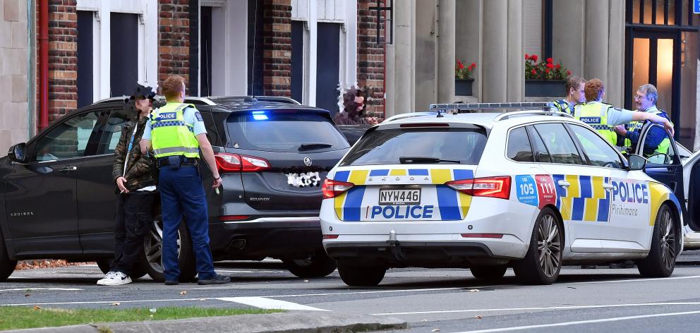 Dunedin police surround a vehicle and a suspected drink-driver who was caught after driving...