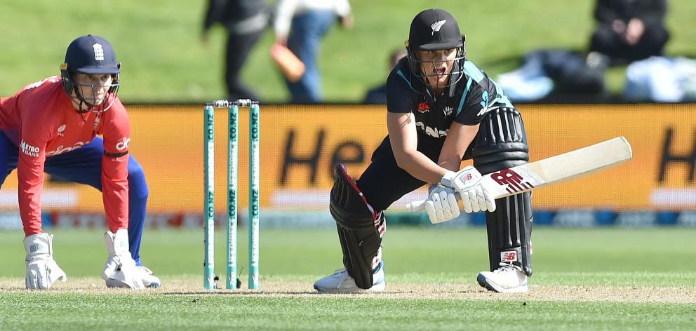 White Ferns stand-in captain Suzie Bates plays a reverse sweep as England wicketkeeper Amy Jones...