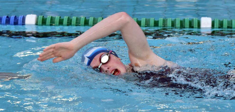 Lawrence Area School pupil Anna Harrex powers along in her cancer charity  swim yesterday.
