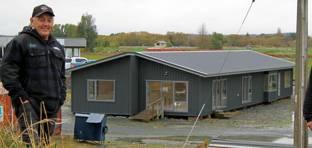 Big River Homes co-directors Mark van Asperen (left) and Adam Turnbull stand outside a 228sqm...