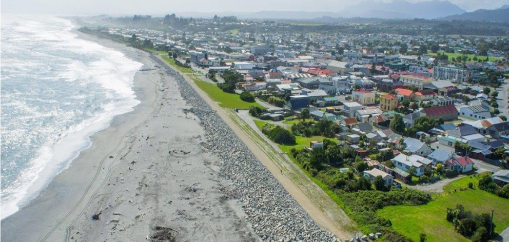 An aerial view of Hokitika looking north along the current seawall towards the northern...
