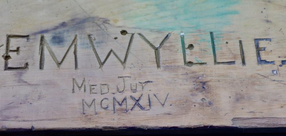 E. M Wyllie, medical junior, left his mark in 1914 on this former medical bench. PHOTO: SIMON...