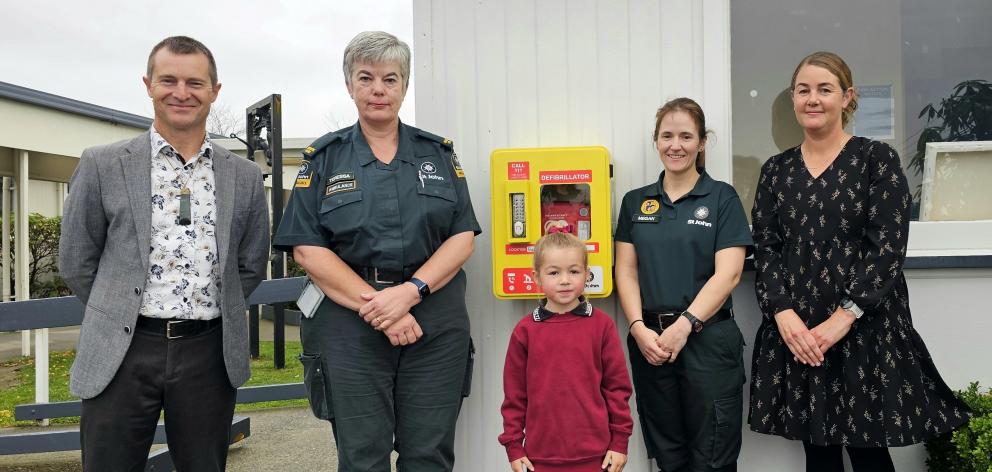 Showing off the newly installed AED at Gleniti School are (from left) Gleniti and North Timaru...