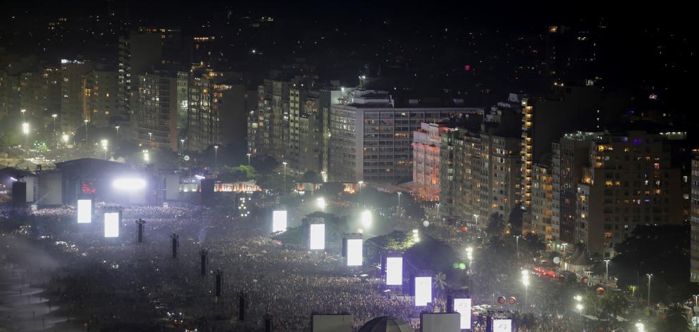People gather at the Copacabana beach ahead of the concert. Photo: Reuters 