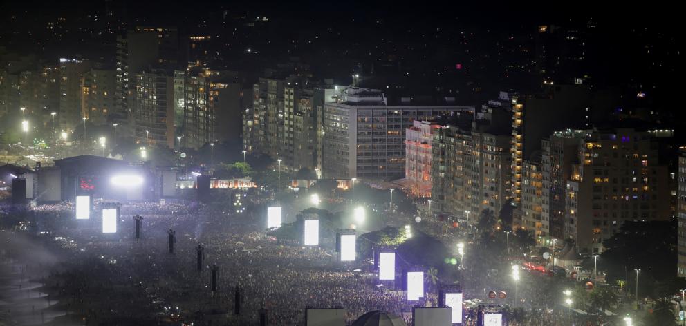 People gather at the Copacabana beach ahead of the concert. Photo: Reuters