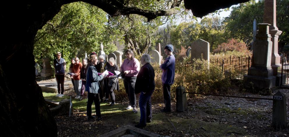 New Zealand Heritage Properties senior archaeologist Bree Wooller (left, foreground) presents a...