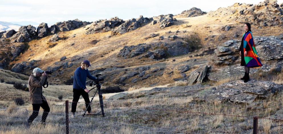 Photographer Derek Henderson and video operator Cam Neate work with model Ngahuia Williams on...