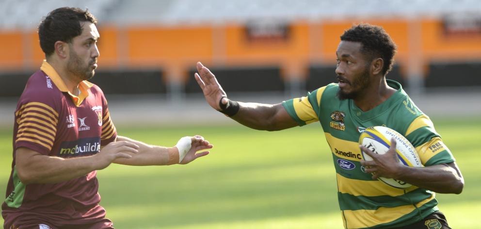 Green Island wing Vilimone Bainibure looks to fend Alhambra Union flanker Tyron Pelasio during...