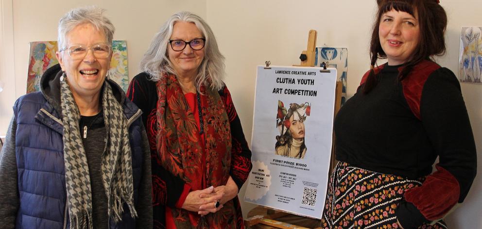 Lawrence Community Arts volunteers (from left) Jan Harper, Karen Armstrong and Rachel Taylor are...
