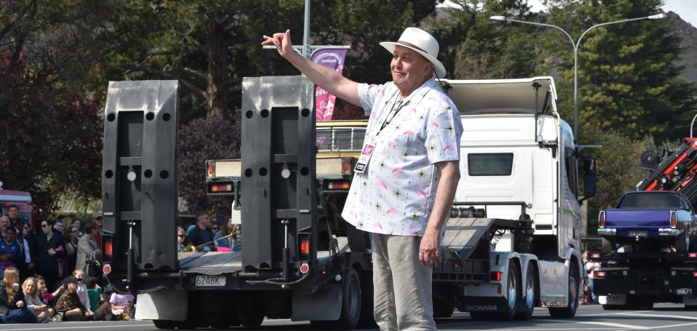 Alexandra Blossom Festival event manager Martin McPherson salutes participants in the Grand...