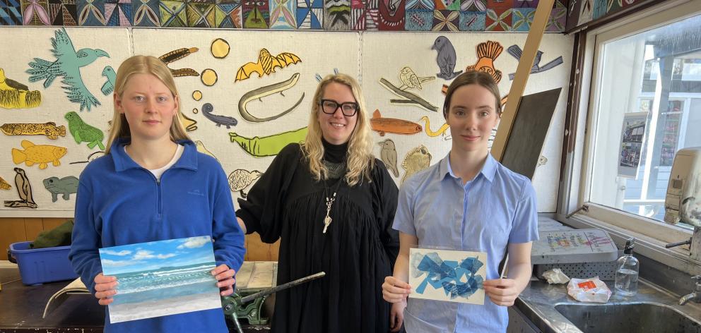 Preparing for the school’s art exhibition at the weekend are Cromwell College students Tayla...