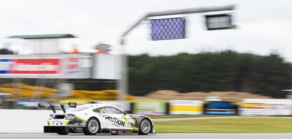 Jordan Michels, of Invercargill, takes the  chequered  flag in his Marc Ford Mustang in the class...