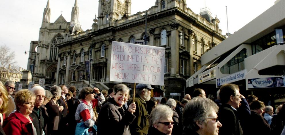 Holding her banner, Pat Restall came from Milton to join the neurosurgery march. PHOTO: ODT FILES