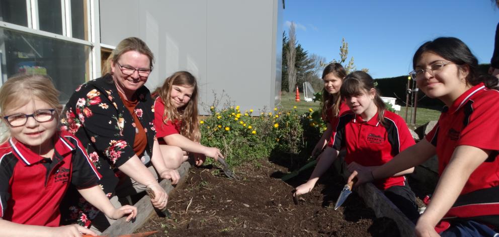 Totara School pupils (from left) Amelia Walsh, 6, teacher aide Jenny Hardwick, Allysra Currie, 9,...