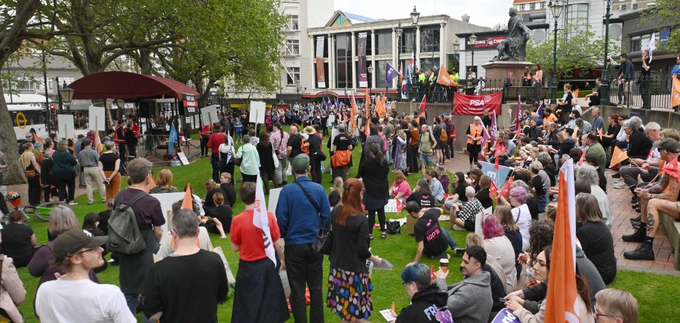 Otago Unions convener Andrew Tait speaks to a protest group in the Octagon yesterday. PHOTOS:...