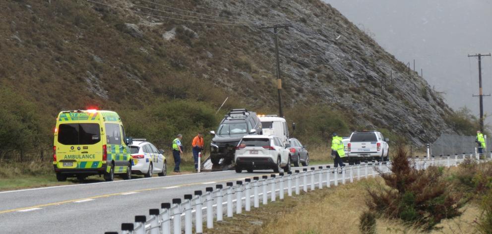 A car is prepared to be towed after being hit by falling rocks this morning. PHOTO: RUBY SHW
