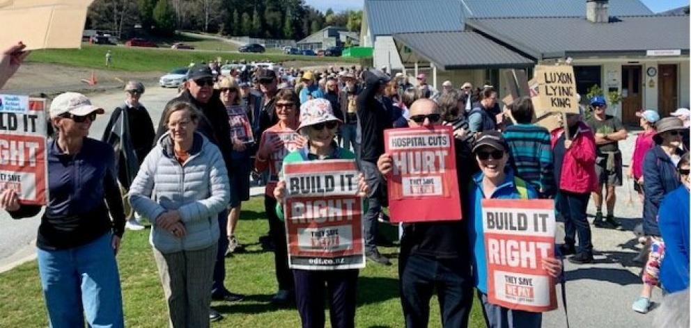 Protesters take part in a 300-strong march through Wānaka on Saturday in opposition to the...