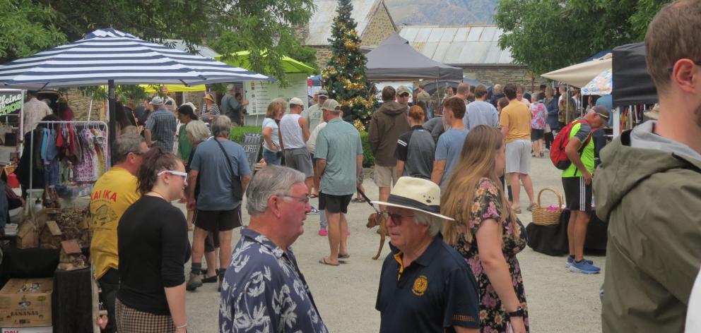 Visitors to the Cromwell Farmers & Craft Market browse the various food and craft stalls.