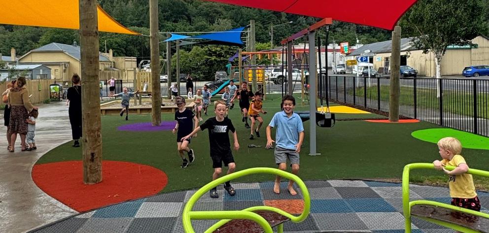 Happy local children share the rides at Lawrence’s new Whitehaven St playground last week. PHOTOS...