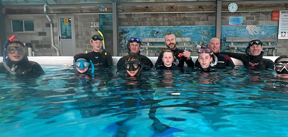 Trainee snorkelers take a break from buddy diving at the Dive Otago Baden McNabb Ocean Safety...