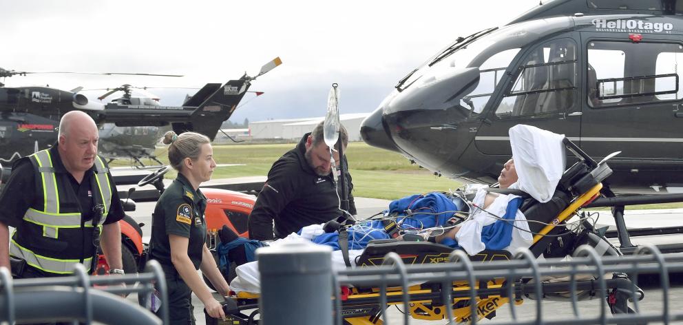 A patient from a crash on State Highway 6 at Kingston is transferred to an ambulance on the...