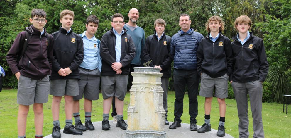 Professor Chris Hepburn (centre) at Waitaki Boys’ High School with years 9 and 10 pupils (from...