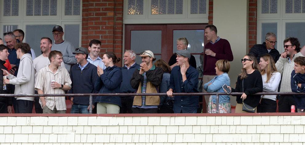 Punters enjoy the action from the grandstand at the Wingatui Racecourse.