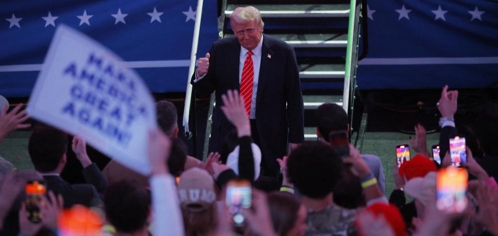 Donald Trump gestures to the crowd at Capital One Arena in Washington DC. Photo: Reuters