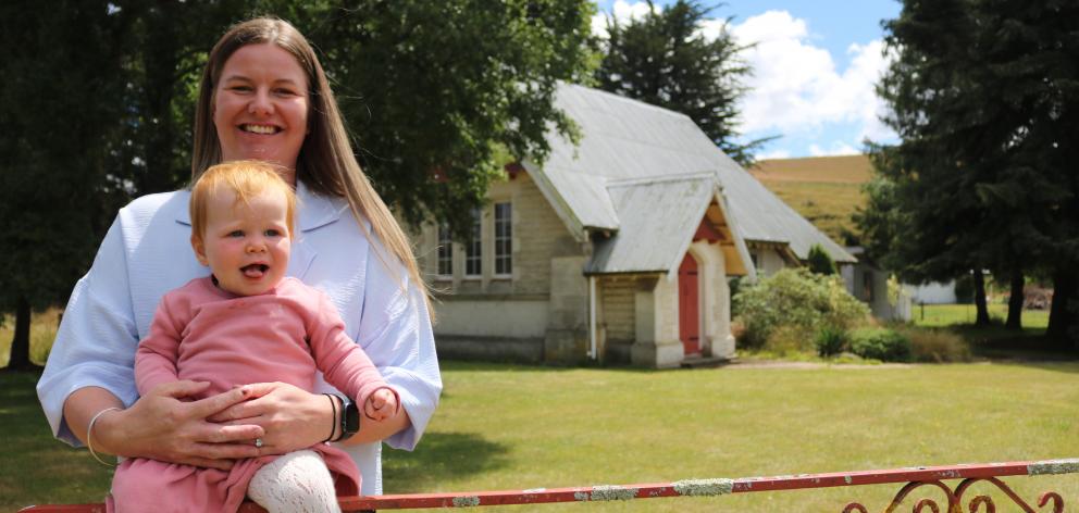 Tokarahi local Tara Hutton at St Peter’s Church with her 11-month-old daughter, Ava. PHOTO: JULES...