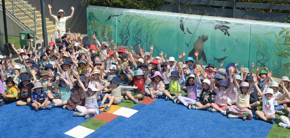 Maori Hill School pupils and their teacher Sarah Freiburger celebrate a new mural of Otago...
