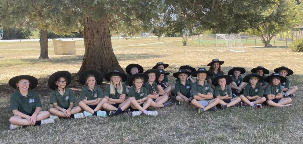 Tarras School pupils enjoy the shade during their sunny lunch break. PHOTO: RAWAN SAADI