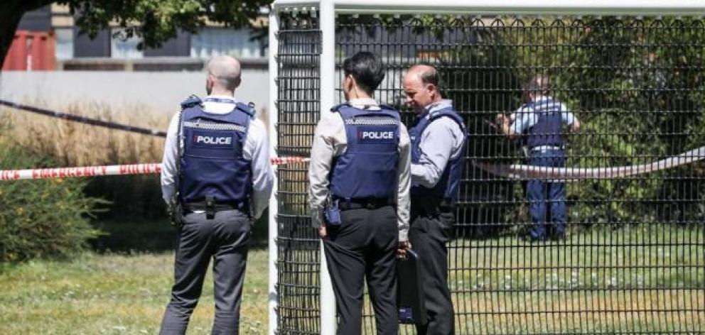 Police at the scene of the alleged attack in the Richmond Village Green on Stanmore Rd. Photo: RNZ