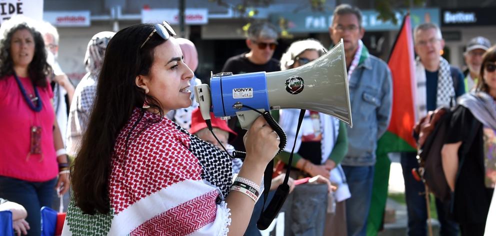 Organiser Rinad Tamimi speaks to the protest group who gathered in the Octagon on Saturday to...