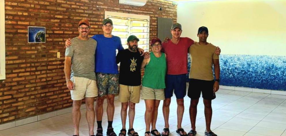 After eight days of tiling in a heatwave with power cuts and no water are (from left) Matt...