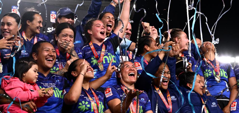 Blues players celebrate back-to-back titles.