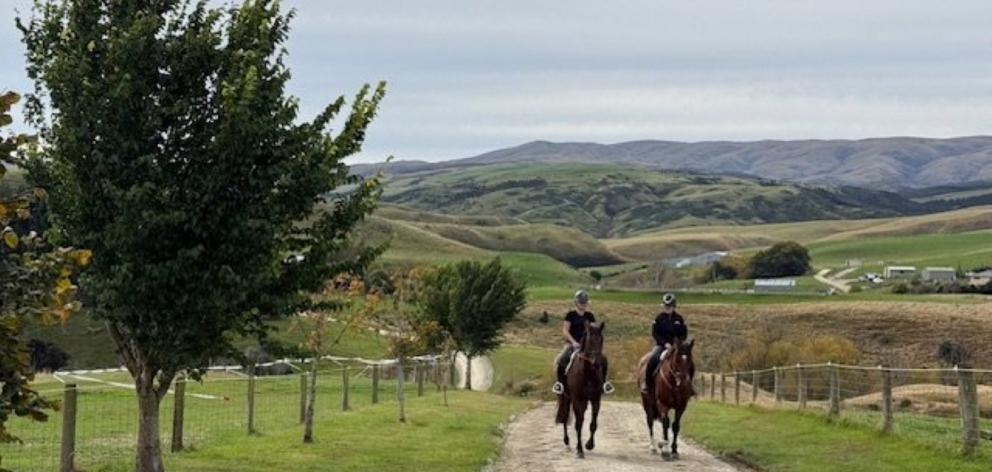Jess (left) and Grace Hore on the horses Beaumont Fine (left) and Beaumont Syd at the station....