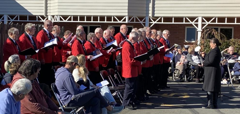 The Dunedin RSA Choir sings a hymn, accompanied by the Kaikorai Metropolitan Brass Band, during...