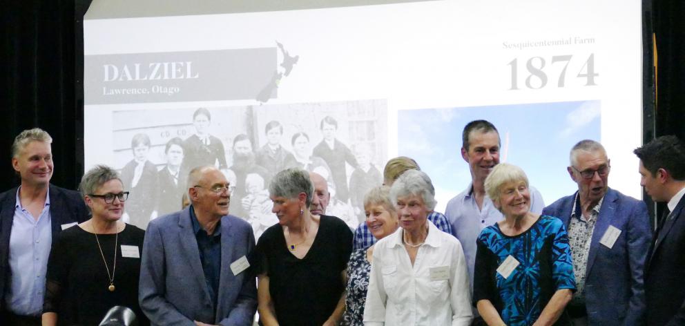 The Dalziel family, of Lawrence, receive their sesquicentennial Century Farms Award from Minister...