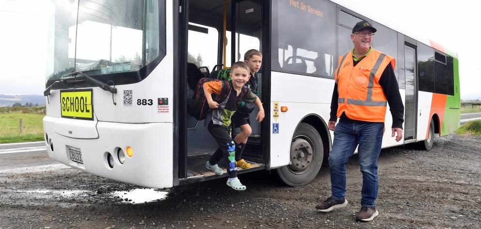 Outram School pupils Walter Morrissey, 8 (left), and his brother George, 5, jump out of the...