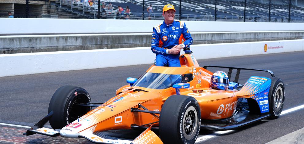IndyCar driver Scott Dixon poses for a photo after qualifying on May 17.