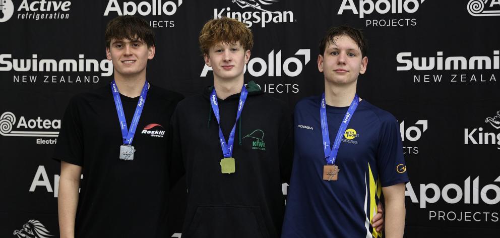 Kiwi swimmer Alfie Weatherston Harvey is flanked by Ethan Stocks (left), of Roskill, and Jack...