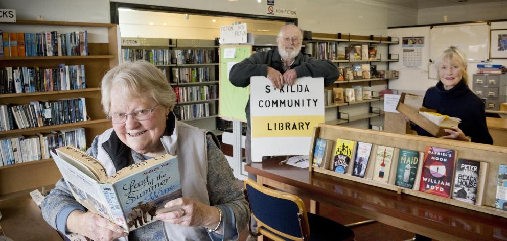 St Kilda Community Library volunteers (from left) Helen Parry, Wayne Sutherland and Terri Saxon...