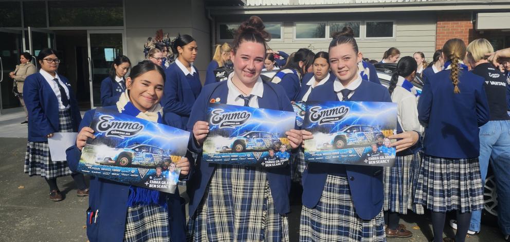 Showing off their newly acquired Emma Gilmour posters are TGHS students (from left) Maria-Moana...