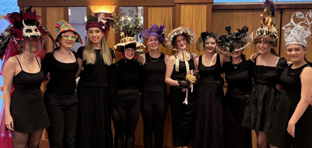 Students from Ella Thomas Vocal Studio model hats at the Timaru Festival of Roses, as part of...