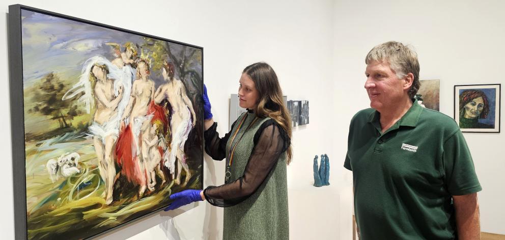 Hanging a piece by acclaimed Otago artist Anita DeSoto for the Timaru North Rotary Art Auction...