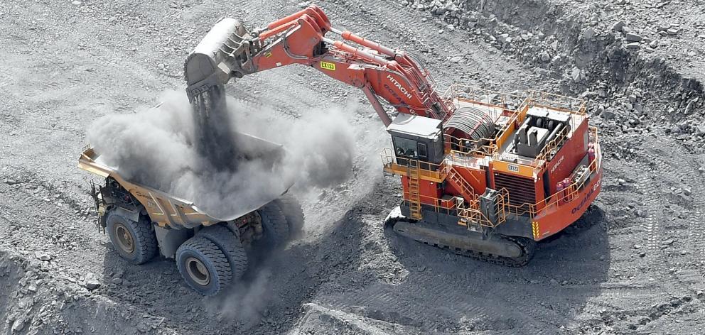 Rock is dropped on to a dump truck at Macraes gold mine. PHOTO: STEPHEN JAQUIERY
