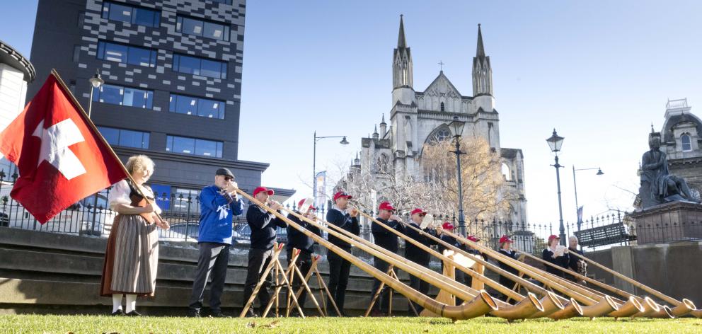 The Taranaki Swiss Club Alphorn Group performs in the Octagon, conducted by Alan Beck (below),...