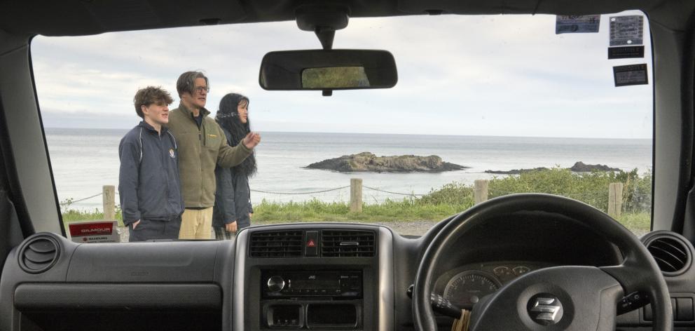 Lloyd McGinty, with son Tahu, 15, and daughter Arianna, 16, stand in one of the Smaills Beach...